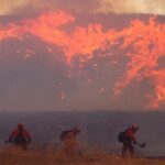 The fast-moving Hughes Fire has consumed nearly 10,000 acres north of Los Angeles